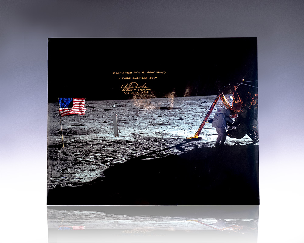 Large photograph of Neil Armstrong on the moon during the Apollo 11 mission; signed by Capsule Communicator Charlie Duke